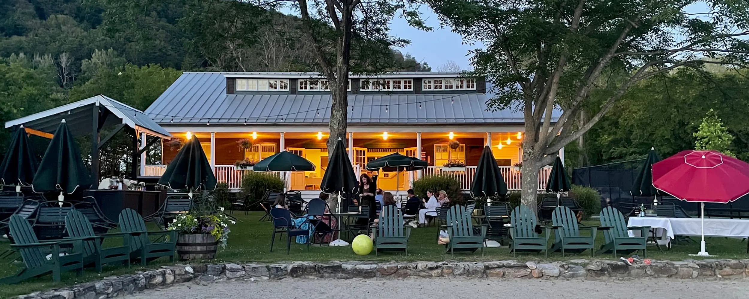 The Twin Lakes Beach Club clubhouse at dusk on East Twin Lake